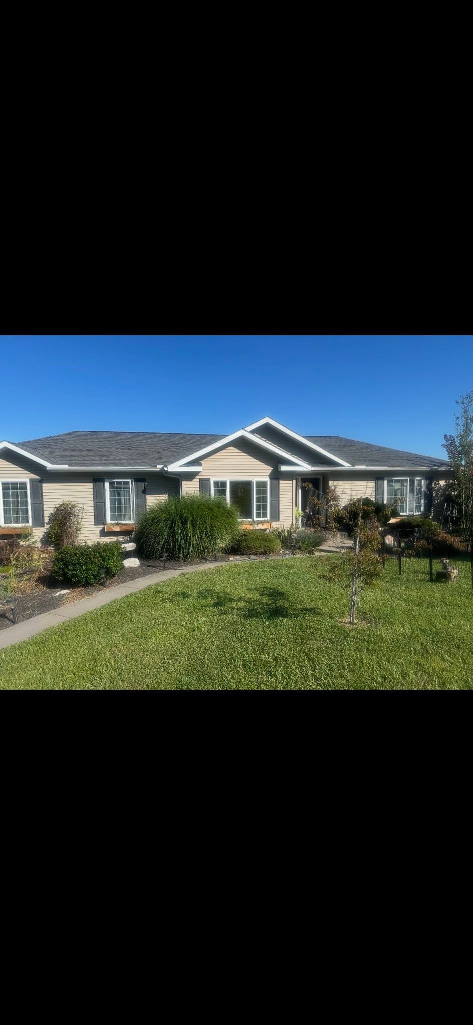 Exterior repaint of tan ranch home
