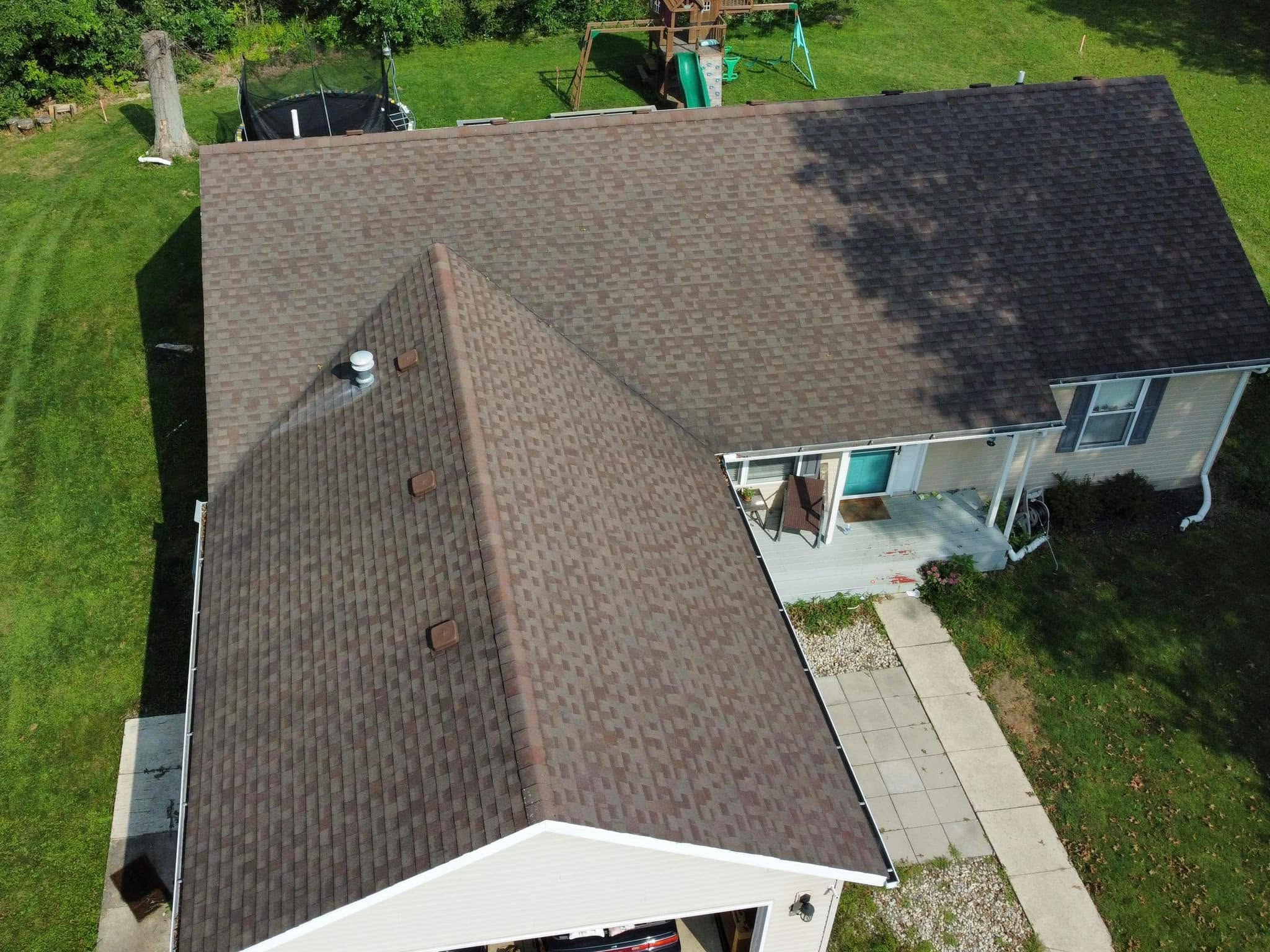 Before: worn asphalt shingle roof